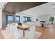 Stylish living space with ocean views, open floor plan, hardwood floors, a modern kitchen, and a fireplace at 2087 Michigan Ne Ave, St Petersburg, FL 33703