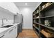 Functional pantry with shelving for storage, modern appliances, and a sink for added convenience at 2087 Michigan Ne Ave, St Petersburg, FL 33703
