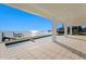 Expansive waterfront patio featuring a zero-edge pool, covered seating area, and a private dock at 2087 Michigan Ne Ave, St Petersburg, FL 33703