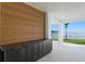 Outdoor patio area with a built-in bar, waterfront views, and access to the lawn at 2087 Michigan Ne Ave, St Petersburg, FL 33703