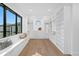 Bright walk-in closet with custom shelving, a window seat, and modern design at 2087 Michigan Ne Ave, St Petersburg, FL 33703