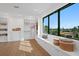 Spacious walk-in closet with custom shelving, window seat, and natural light at 2087 Michigan Ne Ave, St Petersburg, FL 33703