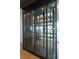 Wine cellar featuring glass enclosures and custom racking to showcase your wine collection at 2087 Michigan Ne Ave, St Petersburg, FL 33703