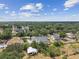 Aerial view of a neighborhood featuring well-maintained homes and lush greenery at 2202 Colewood Ln, Dover, FL 33527