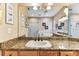 Bright bathroom with granite counters, natural wood, and walk-in shower at 2202 Colewood Ln, Dover, FL 33527