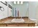 Bathroom vanity with granite countertop and framed mirror at 2202 Colewood Ln, Dover, FL 33527