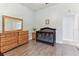 Bedroom with a crib and wood-look floors at 2202 Colewood Ln, Dover, FL 33527
