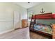 Light filled bedroom with bunkbeds at 2202 Colewood Ln, Dover, FL 33527