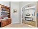 A view of an entry with a built-in cabinet and countertop, neutral walls, and a view of other living spaces at 2202 Colewood Ln, Dover, FL 33527