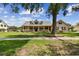 Inviting single-Gathering home with a spacious front yard, covered porch, and mature shade trees at 2202 Colewood Ln, Dover, FL 33527