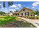 Charming single-Gathering home featuring a covered front porch, a well-maintained yard, and attractive landscaping at 2202 Colewood Ln, Dover, FL 33527