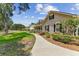 Inviting one-story home with a spacious front lawn, covered porch, and established shade trees at 2202 Colewood Ln, Dover, FL 33527