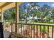 Inviting view from the front porch with a seating area, perfect for enjoying the scenic neighborhood at 2202 Colewood Ln, Dover, FL 33527