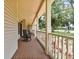 Relaxing front porch featuring classic rocking chairs and a beautiful brick floor at 2202 Colewood Ln, Dover, FL 33527