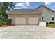 Two-car garage offering ample parking and storage space, located on a well-maintained driveway at 2202 Colewood Ln, Dover, FL 33527