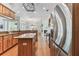 Spacious kitchen features wooden cabinets, granite countertops, stainless steel appliances, and center island at 2202 Colewood Ln, Dover, FL 33527