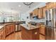 Kitchen with stainless steel appliances, granite countertops and wooden cabinets at 2202 Colewood Ln, Dover, FL 33527