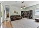Open living room with a large bookcase and comfortable seating area at 2202 Colewood Ln, Dover, FL 33527