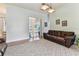 Cozy living room with plush carpeting and slider access to the pool area at 2202 Colewood Ln, Dover, FL 33527