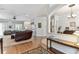 An open-concept living room with hardwood floors, neutral walls, and a view of other living spaces at 2202 Colewood Ln, Dover, FL 33527
