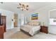 A main bedroom with large bed, sitting area and a peaceful atmosphere at 2202 Colewood Ln, Dover, FL 33527