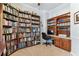 A home office with neutral walls, carpeted floors, and large bookshelves for storage or display at 2202 Colewood Ln, Dover, FL 33527