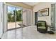 Relaxing sunroom with a sliding glass door leading to the outdoor patio area and garden at 2202 Colewood Ln, Dover, FL 33527