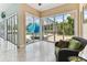 Enclosed sunroom with views of the pool area and lots of natural light coming through multiple sliding glass doors at 2202 Colewood Ln, Dover, FL 33527