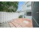 Backyard featuring a paver patio with white gravel detail and a partial view of the side of the house at 2456 Alhambra St, Clearwater, FL 33761