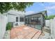 Backyard featuring a screened-in lanai with a hot tub and a paver patio at 2456 Alhambra St, Clearwater, FL 33761