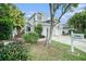 Inviting townhome with neatly kept landscaping, a visible mailbox, and a two-car driveway at 2456 Alhambra St, Clearwater, FL 33761
