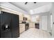 A bright kitchen equipped with updated appliances, ample cabinet space, and tile flooring at 2456 Alhambra St, Clearwater, FL 33761