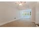 Bedroom featuring new carpet and a sunroom at 246 18Th Ne Ave, St Petersburg, FL 33704