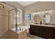 Bathroom features a soaking tub, walk-in shower, and double vanity at 2614 Brookforest Dr, Wesley Chapel, FL 33544