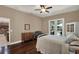 Comfortable bedroom with hardwood floors and a French door at 2614 Brookforest Dr, Wesley Chapel, FL 33544
