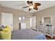 Bedroom with hardwood floors, white furniture, neutral walls, and white trim at 2614 Brookforest Dr, Wesley Chapel, FL 33544