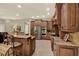 Beautiful kitchen featuring custom cabinetry, granite countertops, stainless steel appliances, and a breakfast bar at 2614 Brookforest Dr, Wesley Chapel, FL 33544