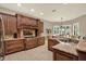 Gourmet kitchen with custom wood cabinets, granite countertops, and stainless steel appliances, a chef's dream at 2614 Brookforest Dr, Wesley Chapel, FL 33544