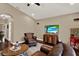 Living room with leather furniture, wood floors, and TV at 2614 Brookforest Dr, Wesley Chapel, FL 33544