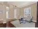 Cozy living room with hardwood floors, plantation shutters, and comfortable seating, creating an inviting space at 2614 Brookforest Dr, Wesley Chapel, FL 33544
