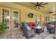 Covered patio with comfortable seating and a ceiling fan at 2614 Brookforest Dr, Wesley Chapel, FL 33544