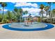 A colorful community splash pad with playful water features and seating areas, designed for Gathering fun and enjoyment at 2614 Brookforest Dr, Wesley Chapel, FL 33544