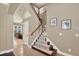Spacious entryway and carpeted staircase with natural light at 2614 Brookforest Dr, Wesley Chapel, FL 33544