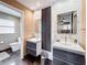 Bathroom with double sinks, modern vanity, and stylish tile accents on walls and floors at 2742 Sea Pines E Cir, Clearwater, FL 33761