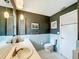 Bathroom with blue tiling, white cabinetry, and modern hardware at 2742 Sea Pines E Cir, Clearwater, FL 33761