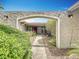 Charming front entry featuring a stone walkway and lush landscaping at 2742 Sea Pines E Cir, Clearwater, FL 33761