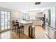 Large kitchen with stainless steel appliances and a center island with bar stool seating at 2742 Sea Pines E Cir, Clearwater, FL 33761