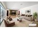 Staged living room with comfortable seating, area rug, and grand piano at 2742 Sea Pines E Cir, Clearwater, FL 33761