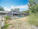 Backyard view showcasing the screened-in pool and surrounding greenery, creating a private oasis at 2742 Sea Pines E Cir, Clearwater, FL 33761