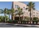 Attractive condo building with well-maintained landscaping, covered parking, and a serene neighborhood setting at 2750 Reserve Ct # 101, Dunedin, FL 34698